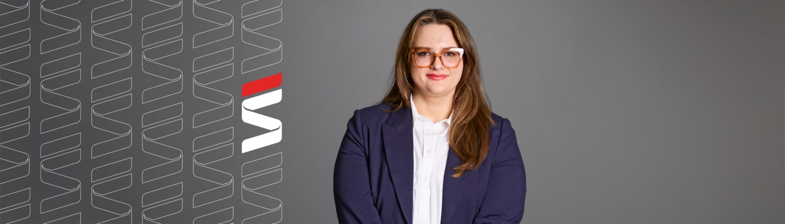 Megan Halbur, Fraser Stryker attorney, wearing a dark blue suit jacket and white shirt.